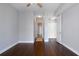 Bedroom featuring dark hardwood floors, a ceiling fan, with blue-grey painted walls at 270 17Th Nw St # 2210, Atlanta, GA 30363