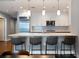 Modern kitchen features a large quartz countertop island with pendant lighting and stainless steel appliances at 270 17Th Nw St # 2210, Atlanta, GA 30363