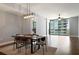 Bright living space with hardwood floors, modern lighting, and large windows with scenic views at 270 17Th Nw St # 2210, Atlanta, GA 30363
