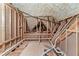 Exposed attic framework and insulation reveal the home's construction and energy efficiency at 5765 Riley Rd, Cumming, GA 30028