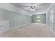 Large bonus room with neutral walls and carpet with a ceiling fan and a window at 5765 Riley Rd, Cumming, GA 30028