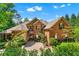 Beautiful brick home with a well-manicured lawn and mature landscaping, creating inviting curb appeal at 5765 Riley Rd, Cumming, GA 30028