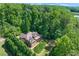 Beautiful home nestled within a lush, mature forest with large backyard at 5765 Riley Rd, Cumming, GA 30028