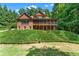 Spacious brick home features a large screened porch overlooking the backyard at 5765 Riley Rd, Cumming, GA 30028