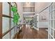 Grand foyer with hardwood floors, soaring ceilings, and an open staircase leading to the upper level at 5765 Riley Rd, Cumming, GA 30028