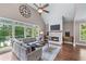 Cozy living room with large windows offering backyard views at 5765 Riley Rd, Cumming, GA 30028