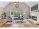 Living room with vaulted ceilings, a fireplace, and ample seating at 5765 Riley Rd, Cumming, GA 30028