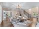 Spacious living room with hardwood floors, fireplace and staircase at 5765 Riley Rd, Cumming, GA 30028