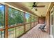 Covered porch with views of the backyard and ceiling fans for comfort at 5765 Riley Rd, Cumming, GA 30028