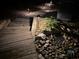 Outdoor steps showcasing landscape lighting and the rocky terrain of the backyard at 5765 Riley Rd, Cumming, GA 30028