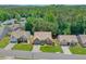 Aerial view of a home surrounded by lush greenery and mature trees in a suburban neighborhood at 935 Santa Anita Dr, Woodstock, GA 30189