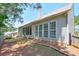 This house has a spacious backyard and a partially screened-in back porch at 935 Santa Anita Dr, Woodstock, GA 30189
