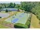 Outdoor basketball court and tennis courts with lush green surroundings enhance this community's recreational appeal at 935 Santa Anita Dr, Woodstock, GA 30189