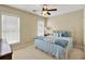 Bedroom with blue accents, beige carpet and neutral walls at 935 Santa Anita Dr, Woodstock, GA 30189