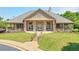 Community clubhouse with American flags, landscaping, and stairs with railings at 935 Santa Anita Dr, Woodstock, GA 30189
