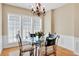 Cozy dining area featuring a round glass table with seating for four and natural light at 935 Santa Anita Dr, Woodstock, GA 30189