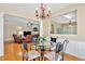 Open-concept dining area with a round table, flowing seamlessly into a living room at 935 Santa Anita Dr, Woodstock, GA 30189