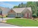 Beautiful home with well-kept lawn and mature landscaping features, offering great curb appeal at 935 Santa Anita Dr, Woodstock, GA 30189