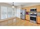 Bright kitchen with stainless steel appliances, granite countertops, and hardwood floors at 935 Santa Anita Dr, Woodstock, GA 30189
