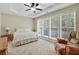 Spacious main bedroom with tray ceiling, neutral carpeting, and large windows at 935 Santa Anita Dr, Woodstock, GA 30189