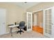 Versatile office space with carpet, French doors, and view into another carpeted room at 935 Santa Anita Dr, Woodstock, GA 30189