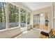 Relax on this screen enclosed patio with views of the wooded backyard at 935 Santa Anita Dr, Woodstock, GA 30189