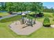 This community playground features a slide, climbing wall, and swings at 935 Santa Anita Dr, Woodstock, GA 30189