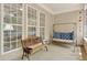 The porch is furnished with an outdoor bench and a cushioned swing at 935 Santa Anita Dr, Woodstock, GA 30189