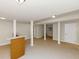 Partially finished basement features a bar, tile floors, and neutral paint at 2480 Miriam Ln, Decatur, GA 30032