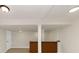 Finished basement features a brick-faced bar area with adjacent doorway and lighting at 2480 Miriam Ln, Decatur, GA 30032