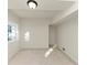 Clean, unfinished basement room featuring neutral walls, a window, and doorway leading to other spaces at 2480 Miriam Ln, Decatur, GA 30032