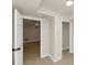 This basement features neutral colored walls and floors, as well as an open doorway leading into another room at 2480 Miriam Ln, Decatur, GA 30032
