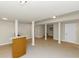 Open basement area with tile floor, brick bar, and support columns offer flexibility for customization at 2480 Miriam Ln, Decatur, GA 30032