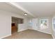 Open basement space with window, door, and partial view of finished room beyond at 2480 Miriam Ln, Decatur, GA 30032