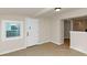 Partially finished basement with window and door leading to other rooms at 2480 Miriam Ln, Decatur, GA 30032