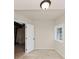 Unfinished basement space with concrete floor, open door to utility area, and a window for natural light at 2480 Miriam Ln, Decatur, GA 30032
