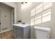 Well-lit bathroom features a modern vanity with stylish fixtures and gray cabinetry at 2480 Miriam Ln, Decatur, GA 30032