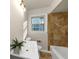 Modern bathroom featuring a single sink vanity, tiled shower, and natural light at 2480 Miriam Ln, Decatur, GA 30032