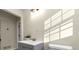 Bright bathroom featuring a sleek vanity with storage and modern fixtures at 2480 Miriam Ln, Decatur, GA 30032