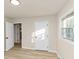 Bedroom with wood flooring, a window, and interior doors to other rooms at 2480 Miriam Ln, Decatur, GA 30032