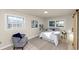 Cozy bedroom featuring two bright windows, hardwood floors, and modern decor accents at 2480 Miriam Ln, Decatur, GA 30032