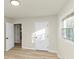 Bedroom showcasing hardwood flooring, a doorway, and natural light from windows at 2480 Miriam Ln, Decatur, GA 30032