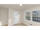 Bedroom featuring two windows, hardwood floors, and a closet at 2480 Miriam Ln, Decatur, GA 30032