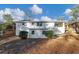 Back of a two-story home with an attached covered porch and small grassy area at 2480 Miriam Ln, Decatur, GA 30032