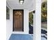 Beautiful front door and covered porch area with white pillars at 2480 Miriam Ln, Decatur, GA 30032