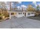 Charming single story home boasting a covered front porch and attached carport at 2480 Miriam Ln, Decatur, GA 30032