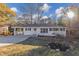 Charming single-story home features a covered carport and well-maintained front yard landscaping at 2480 Miriam Ln, Decatur, GA 30032
