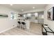 Bright kitchen with white cabinets, granite countertops, and stylish bar seating at 2480 Miriam Ln, Decatur, GA 30032
