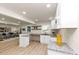 Open kitchen with white cabinets, granite countertops, and a breakfast bar at 2480 Miriam Ln, Decatur, GA 30032