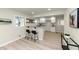 Bright open-concept kitchen and dining area with breakfast bar and natural light at 2480 Miriam Ln, Decatur, GA 30032
